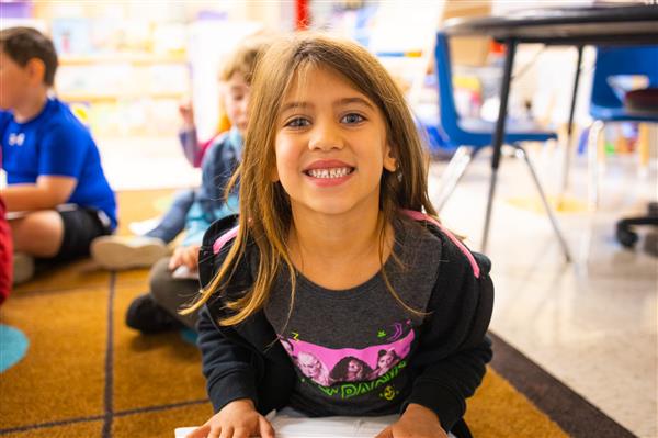 Students inside their classrooms learning. 
